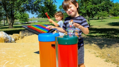 children playing on a musical playground