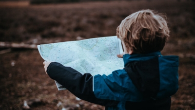 boy looking at a map