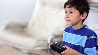 Gamer boy playing video game