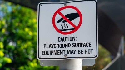 Hot playground surface warning sign