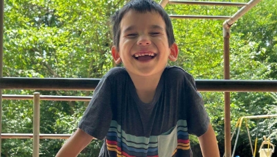 Happy boy playing on playground