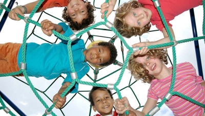 Kids climbing on a rope playground