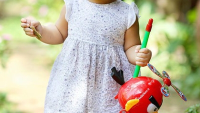 Girl playing with a helicopter
