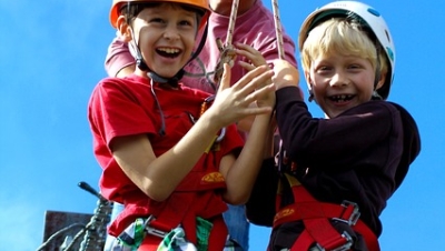 Kids excited to ride a zip line.