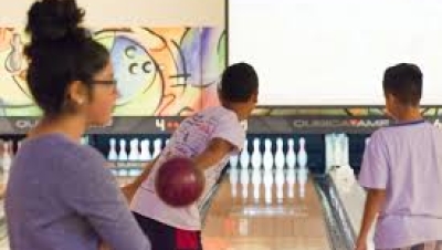 Teenagers enjoying bowling